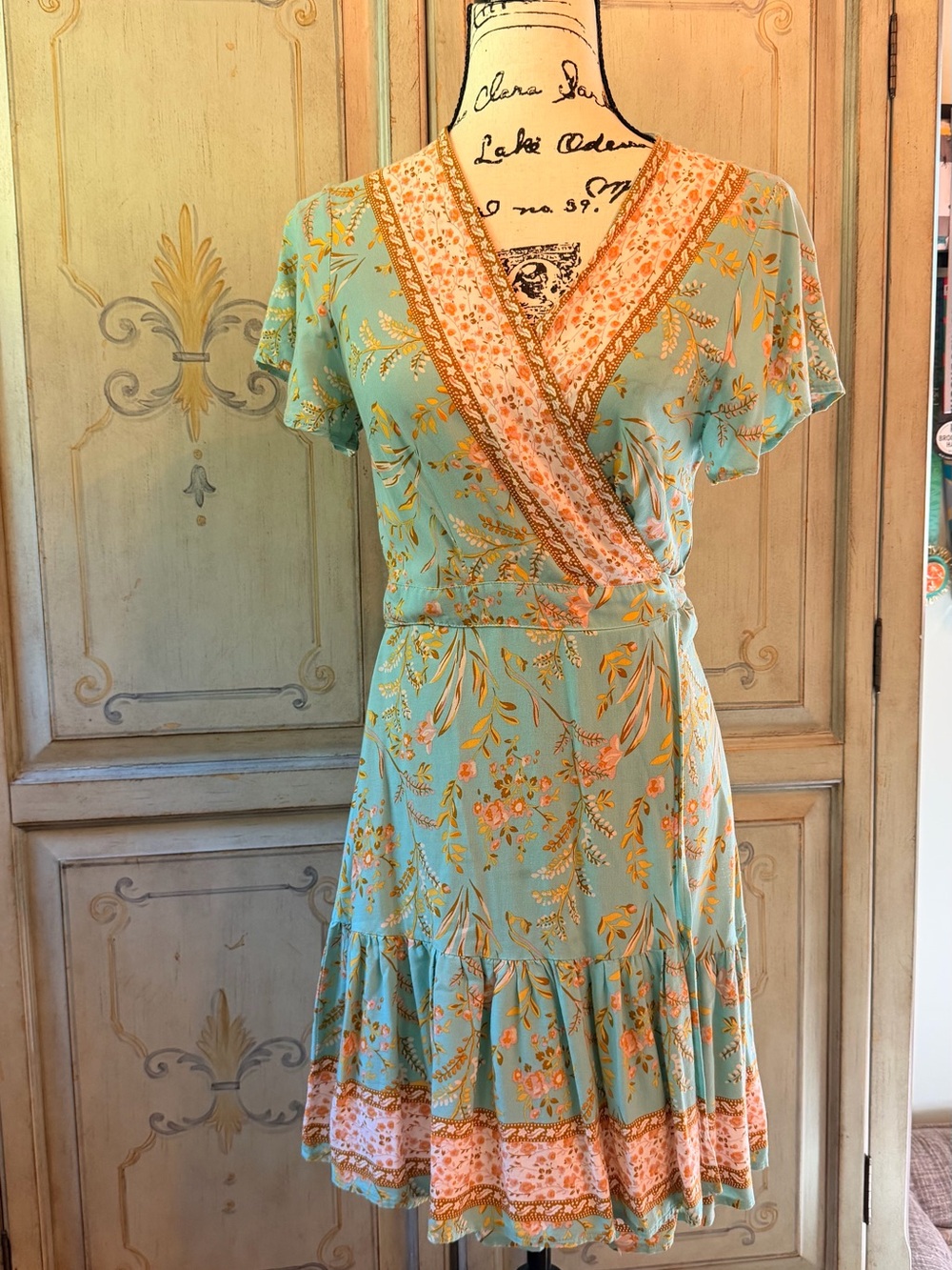 Zesika Floral Wrap Midi Dress in Mint with Peach Trim